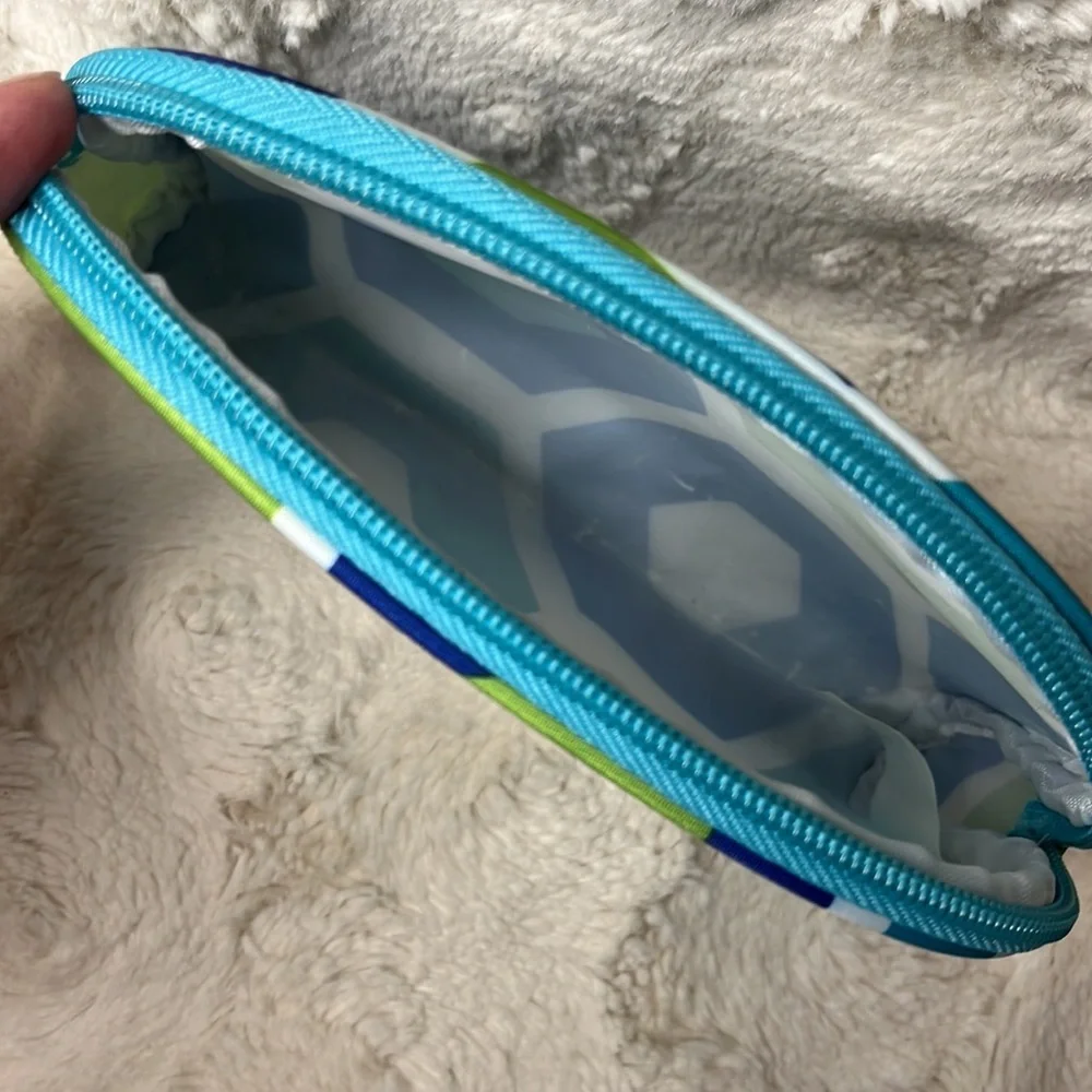 Small cosmetic bag with zip top closure.